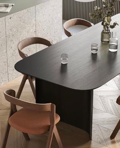 a wooden table with two chairs around it