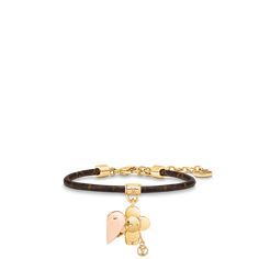 a bracelet with an elephant charm on the front and a heart charm on the back