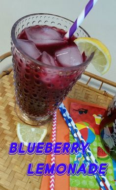 blueberry lemonade in a glass on a tray