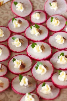 radishes are arranged on a plate with cream cheese