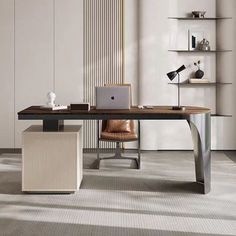 a modern desk with a laptop on it in an office space that is clean and organized