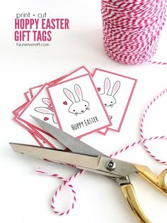 scissors and twine are sitting next to some cards that say happy easter on them