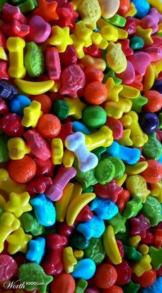 many different colored candies are piled together