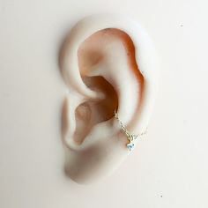 an ear with a chain attached to it