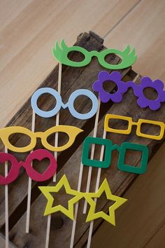 some colorful glasses and stars on sticks