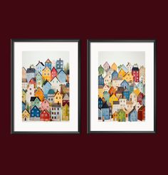 two framed pictures with houses on them