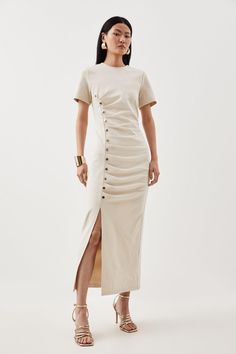 Invest In Sophistication With This Maxi Dress, Crafted From Ponte Fabric That Ruches From Golden Lapel Button Detailing. Featuring A Round Neck, Short Sleeves And Front Split. Pair This Piece With Golden Accessories And Stilettos For A Dress That Can Be Worn From Day To Night.Pontebutton Detailruched Detailingshort Sleevesmaxi Hemline Cream Fitted Button-up Midi Dress, Elegant Cream Button-up Midi Dress, Chic Midi Dresses With Double-breasted Button Fastening, Elegant Beige Button-up Midi Dress, Karen Millen Knit Dress, Golden Accessories, Ponte Fabric, Dress Cream, Cream Dress