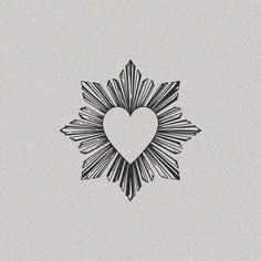 a black and white drawing of a heart in the middle of a starburst