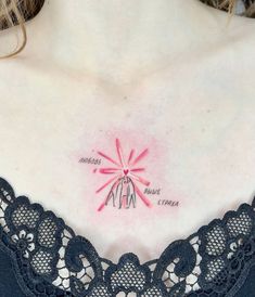 a woman with a tattoo on her chest