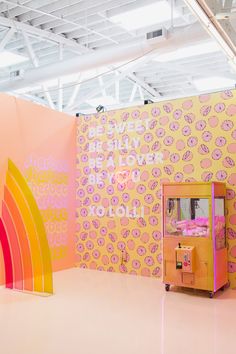 an art installation with pink and yellow walls