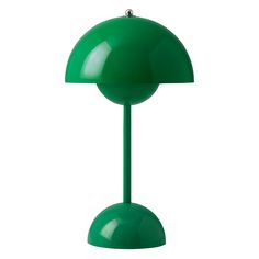 a green table lamp on a white background