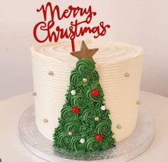 a christmas tree cake is decorated with icing