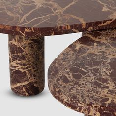 a marbled table with two curved legs