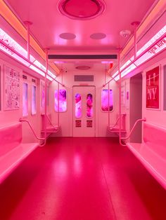 the inside of a pink subway car with red lights on it's walls and windows