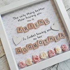 a scrabble frame with words and flowers in it