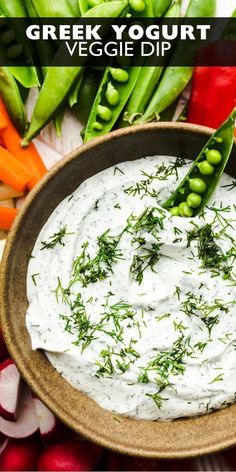 greek yogurt dip in a bowl with vegetables around it and text overlay that reads greek yogurt veggie dip