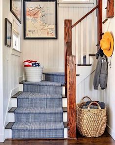 the stairs in this house are painted blue and white