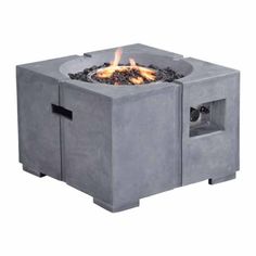 a concrete fire pit with flames in it