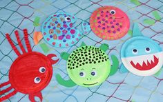 paper plates with fish and sea creatures painted on them