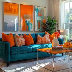 a living room filled with furniture and paintings on the wall next to a coffee table