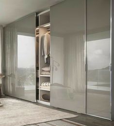 an open closet with sliding doors in a bedroom