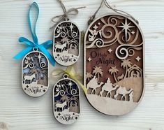 three wooden tags with christmas designs on them