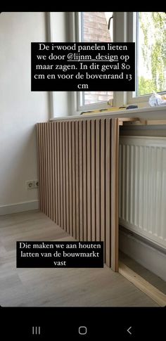 an image of a room with wooden paneling on the wall and windows above it