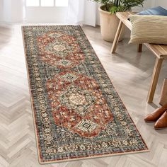 a large rug with an ornate design on the floor