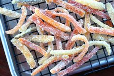 some sugar coated food sitting on top of a cooling rack