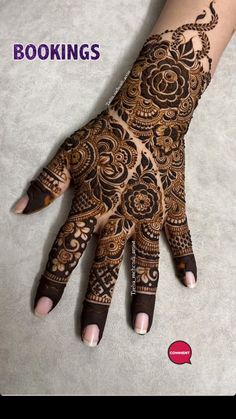 the hand is decorated with henna designs for someone's wedding day or special occasion