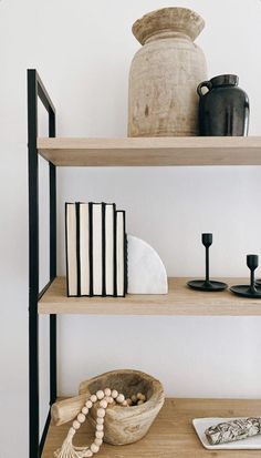 shelves with books, vases and other items on them