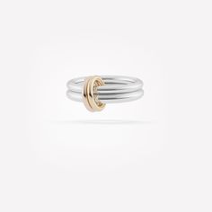 The Calliope is a playfully multi-tonal mainstay, combining two bands of .925 sterling silver with two tactile connectors of pure 18k yellow and rose gold. Understated and elegant, the Calliope is an eloquent interpretation of the harmony of opposites. The Calliope is individually handmade in Los Angeles. Bands: .925 sterling silver 2.3mm gauge .925 sterling silver band 2.8mm gauge .925 sterling silver band Connectors: 18k rose gold, 18k yellow gold Created in 2019 Linked Rings, Two Tone Ring, Galaxy Ring, Luxury Jewelry Brands, Shimmer Shine, Linking Rings, Luxury Rings, Dream Jewelry, Sterling Silver Bands