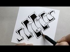 someone is drawing the letters in black and white