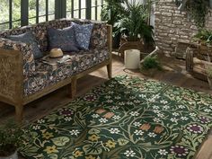 a living room filled with furniture and plants