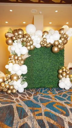 an arrangement of balloons and greenery in the shape of a square