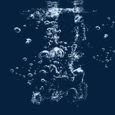 water bubbles floating in the air on a dark blue background