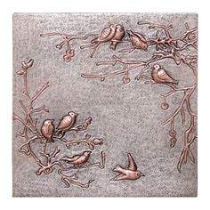 birds are sitting on the branch of a tree with leaves and berries in copper foil