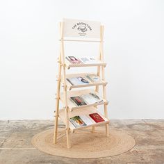 a wooden book stand with books on it