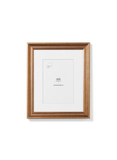 an empty wooden frame hanging on the wall