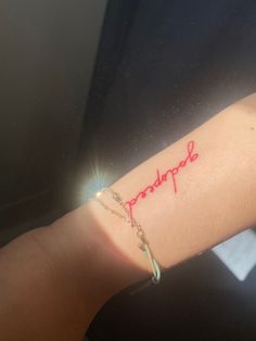 a woman's arm with a tattoo that reads, hope