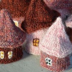 several knitted houses sitting next to each other