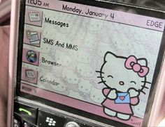 a hello kitty cell phone is shown with the screen showing messages and mms on it