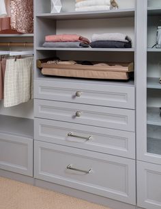 an organized closet with drawers and linens on the shelves, including folded towels or blankets