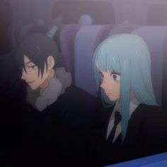 two anime characters are sitting in an airplane seat and one is looking at the camera