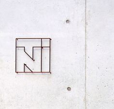 a sign on the side of a building that says n