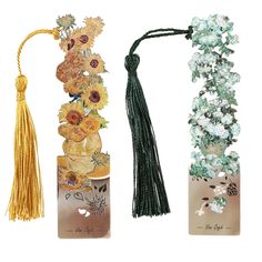 three different types of tassels with flowers and leaves on them, one in gold, the other in green