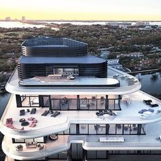 an aerial view of a house on the water