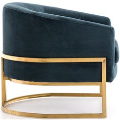 a blue velvet couch with gold metal frame