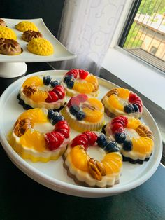 there are many desserts on the plates ready to be eaten