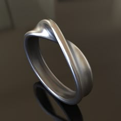 Introducing our delicate handcrafted 925 Sterling Silver Mobius Ring, a minimalist accessory that symbolizes the concept of infinity and the beauty of simplicity. This unique ring features an elegant Mobius design, crafted from high-quality, solid 925 sterling silver to ensure durability and longevity. Our Mobius Ring is a unisex accessory, making it a perfect choice for both men and women who appreciate the elegance of minimalism and the profound symbolism of the Mobius strip. Its understated design serves as a daily reminder of the endless possibilities in life, making it an ideal gift for yourself or a loved one. Whether you're seeking a symbol of your infinite potential or a thoughtful gift for someone who cherishes the beauty of simplicity, our 925 Sterling Silver Mobius Ring is an ex Silver For Men Jewelry, Minimalist Twisted Jewelry For Anniversary, Modern Twisted Rings As A Gift, Minimalist Silver Twisted Ring, Minimalist Twisted Silver Ring, Minimalist Sterling Silver Infinity Ring, Elegant Silver Ring, Infinity Ring Design, Mobius Strip Ring